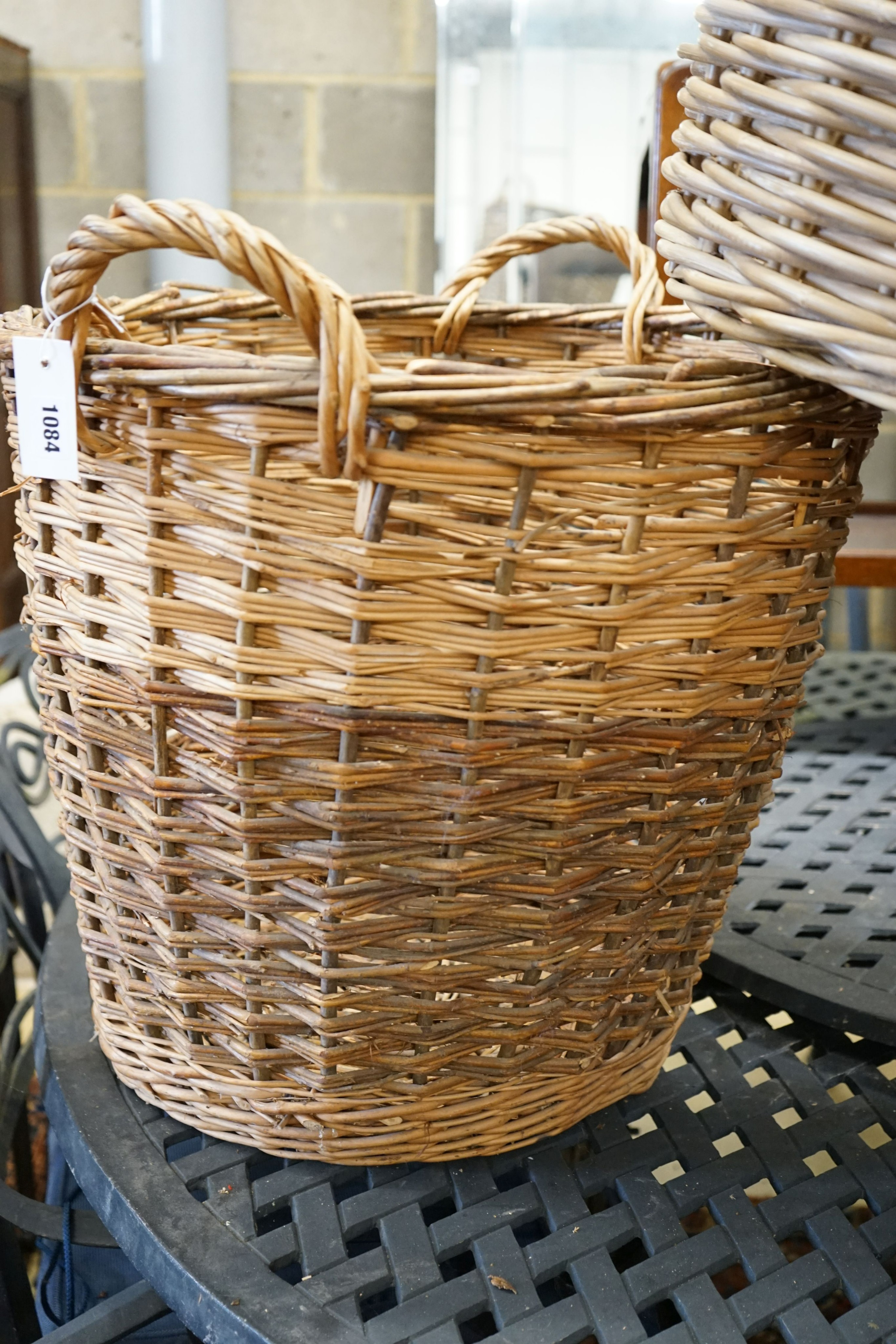 Three aassorted wicker baskets, largest width 59cm, height 53cm